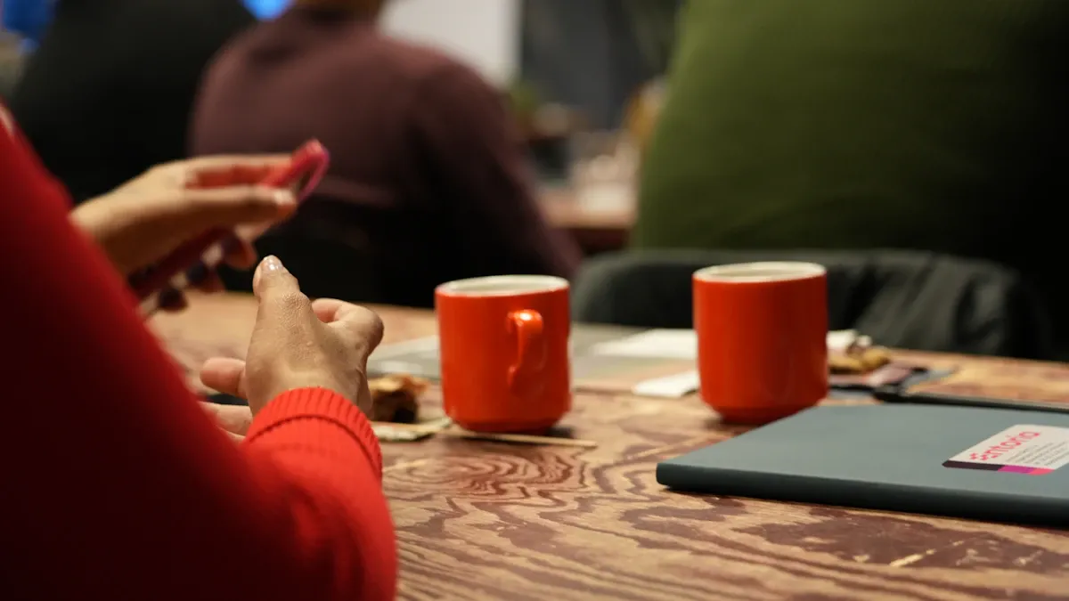Two mugs on a wooden table, facing each other