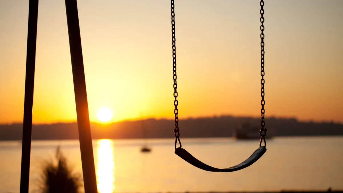 An empty swing backlit in a park